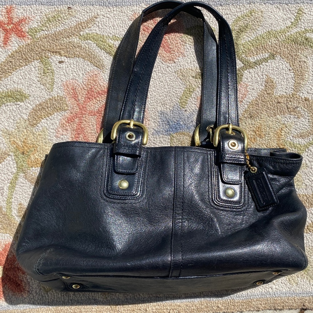 Coach black leather tote with gold buckles